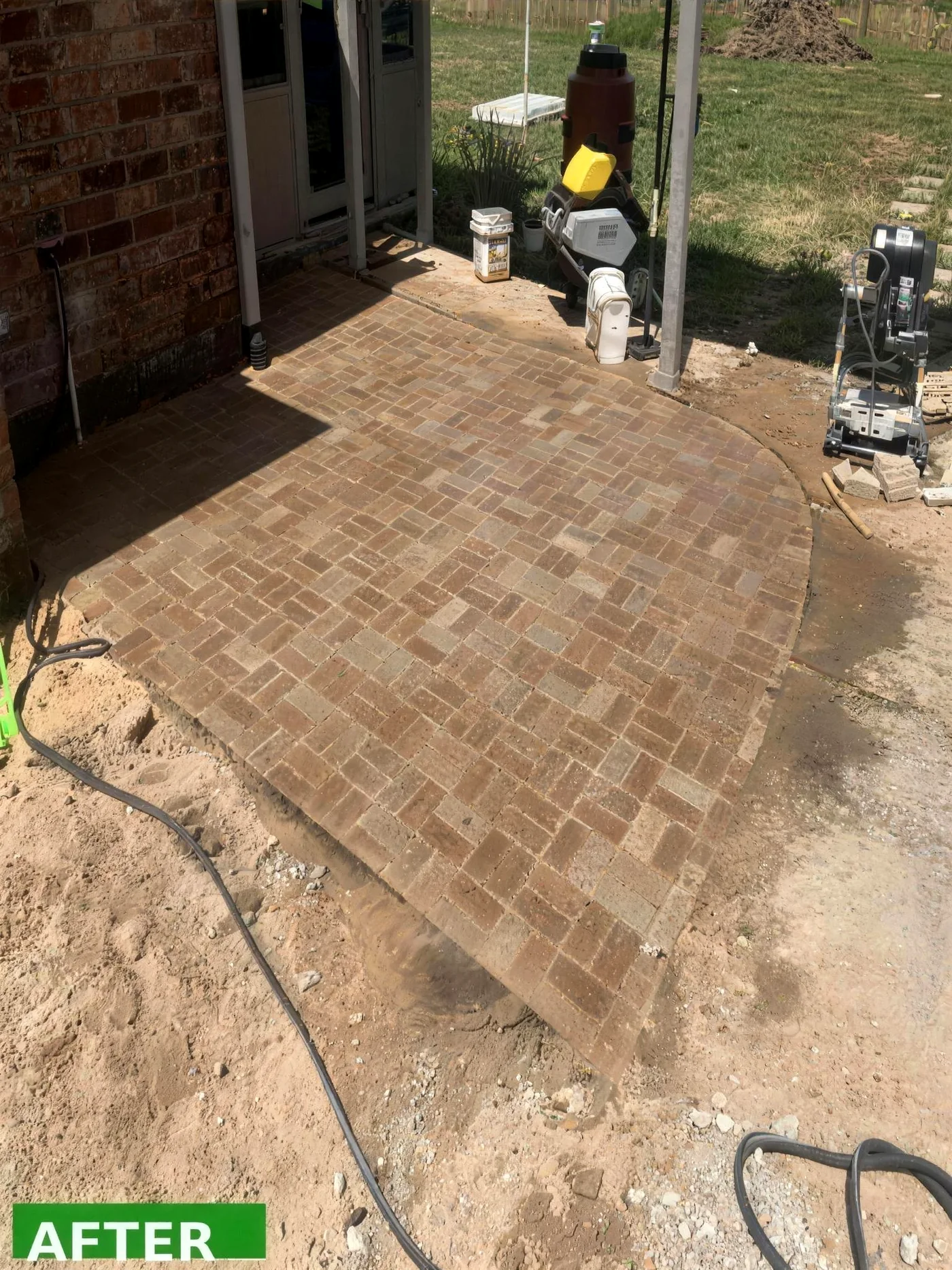 Finished brick paver patio after Mahalic and Sons hardscaping build