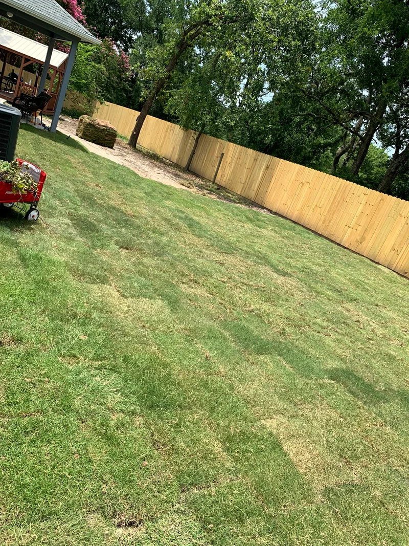 Crisp mow stripes along a fence line on a Josephine property