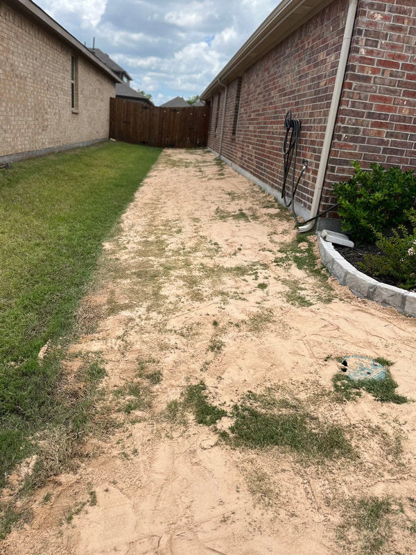 Side yard of a sand leveling job for a satisfied customer